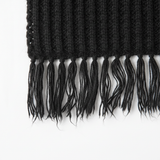 Close-up detail of Mango black fringed edge scarf knitted texture