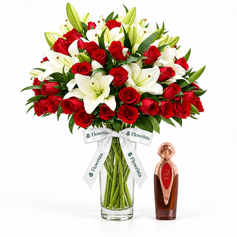 Asser 100ml perfume beside Flowrista red roses and white lilies in a clear glass vase