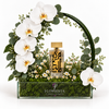 Amir Al Oud Gold 100ml perfume with artificial white orchids and a green arch in a Flowrista box