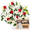 Tobacco Collection wooden perfume case beside red and white roses and white lilies in a Flowrista vase