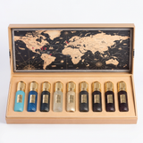 Tobacco Collection perfume bottles in an open wooden presentation case with a map design inside the lid