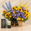 Fakher perfume and Mamoul Ashiq Al.Oud beside a Flowrista basket of yellow sunflowers, roses and purple flowers
