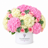 Pink and cream hydrangeas with pink roses in a white Flowrista flower box