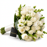 White bridal rose bouquet with mixed white blooms green buds white ribbon handle and Flowrista gift tag