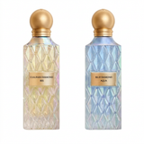Cullinan Diamond Iris 150 ml and Blue Diamond Aqua 150 ml faceted perfume bottles with gold spherical caps