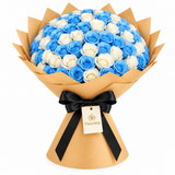 Flowrista blue and white rose bouquet in kraft wrapping with a black bow