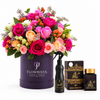 Ashiq Al Oud air freshener and bakhoor beside mixed roses in a purple Flowrista flower box