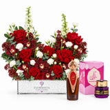 Asser perfume and Saher mamoul beside Flowrista red rose and burgundy orchid arrangement