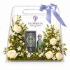 Green and silver Fakher perfume and box with fresh white roses in a clear Flowrista gift bag with lavender ribbon