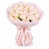 Blush and cream rose bouquet in pale pink wrapping with satin Flowrista bow