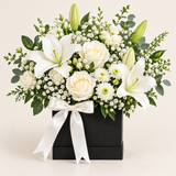 Flowrista white lilies roses and chrysanthemums in a black vase