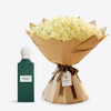 Emerald Soul Diamond perfume beside white roses in brown wrapping with a dark brown ribbon and Flowrista tag