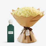 Emerald Soul Diamond perfume beside white roses in brown wrapping with a dark brown ribbon and Flowrista tag