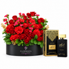 Black Intense perfume beside red roses and carnations in a wide black Flowrista box