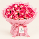 Flowrista bouquet of ivory roses with vivid pink edges, pink wrap and satin bow