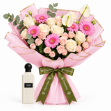 White Regent Diamond 150 ml perfume beside Flowrista pink gerbera and cream rose bouquet