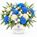 Blue and white hydrangeas in white Flowrista flower vase