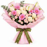 Flowrista pink gerberas, cream roses and white anthuriums in pink wrapping with olive-green ribbons