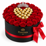 Flowrista red roses with heart-shaped gold-wrapped chocolate centre and tiara in black hatbox