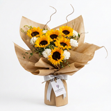 Sunflower and white carnation bouquet in brown wrapping with silver satin ribbon and Flowrista tag