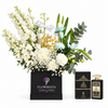 Ashek Al Oud perfume by Almas beside white and blue get-well flowers in a black Flowrista box