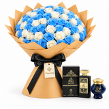 Ashek Al Oud perfume and Omani Bakhour beside a Flowrista blue and white rose bouquet