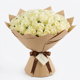 Classic 100 white roses bouquet with greenery, brown wrapping, brown ribbon and Flowrista gift tag