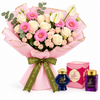 Omani Bakhour and Saher Alkalmet bakhoor beside Flowrista pink gerbera and cream rose bouquet
