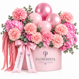Pink carnations, hydrangea, amaranthus and balloons in a pink Flowrista box