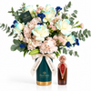 Asser 100ml perfume beside Flowrista pastel flowers in a teal vase with gold base