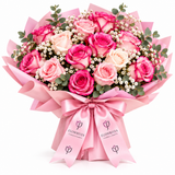 Pink and cream roses with gypsophila in Flowrista pink wrap and satin bow