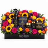 Ashiq Al Oud mamoul bakhoor and air freshener with fresh sunflowers and colourful roses in a black Flowrista planter
