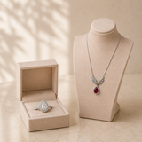 Silvara platinum-plated angel wing zircon pendant necklace and pear-cut halo ring set in beige jewellery box – Dubai