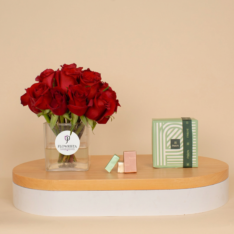 Rose vase with Flowrista logo beside Patchi chocolates